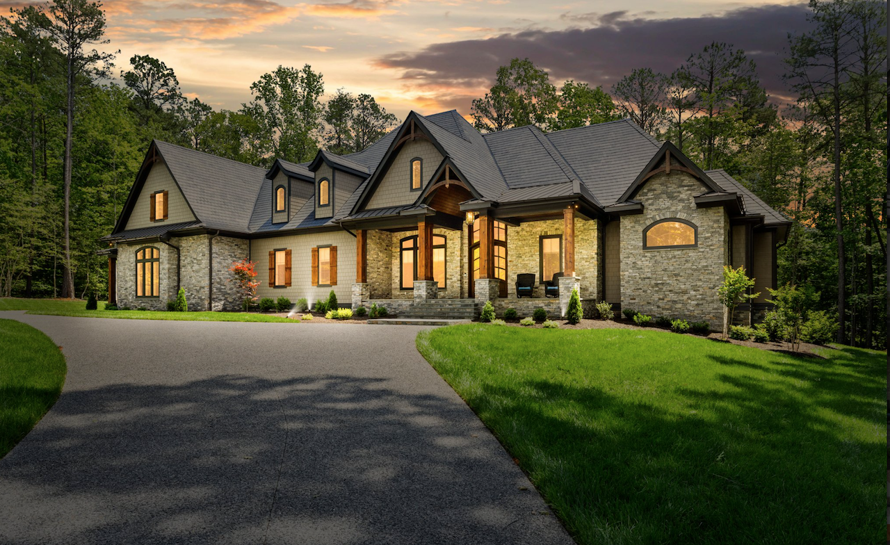 Natural stone veneer exterior on luxury residential home at sunset